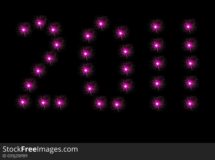 Many small pink illuminated fibre optic lamps arranged over white to spell the number 2011. Many small pink illuminated fibre optic lamps arranged over white to spell the number 2011