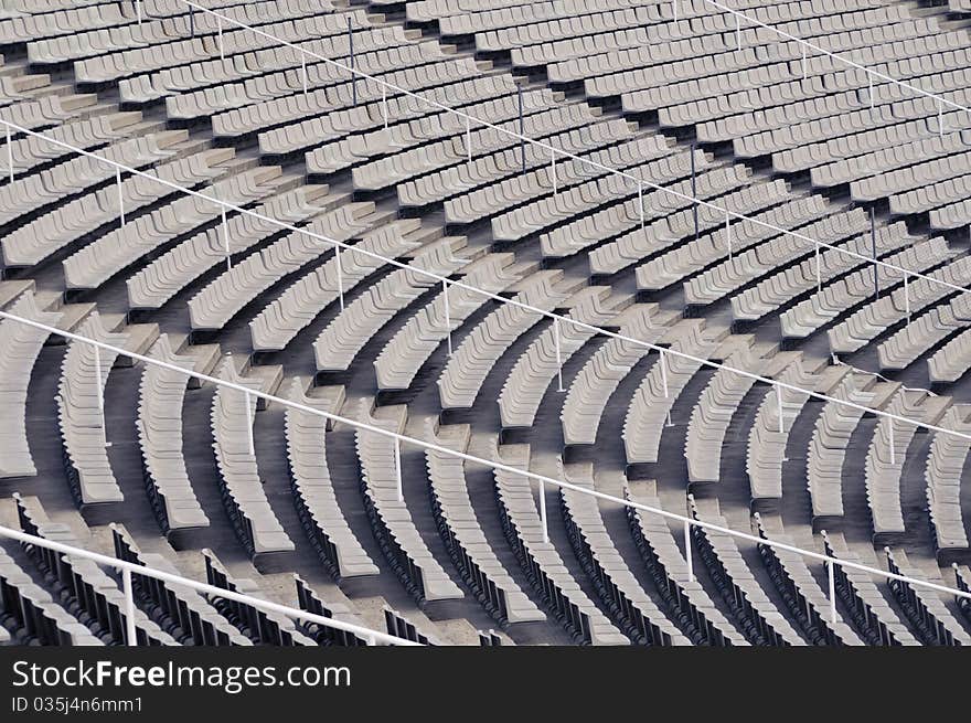 Many empty plastic chair rows on the sport stadium. Many empty plastic chair rows on the sport stadium