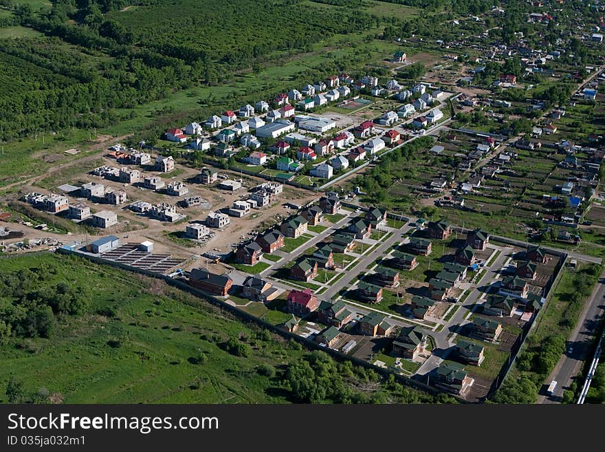 Photo of Town from the helicopter. Cottage settlement - Aerial View. Building of houses. Photo of Town from the helicopter. Cottage settlement - Aerial View. Building of houses