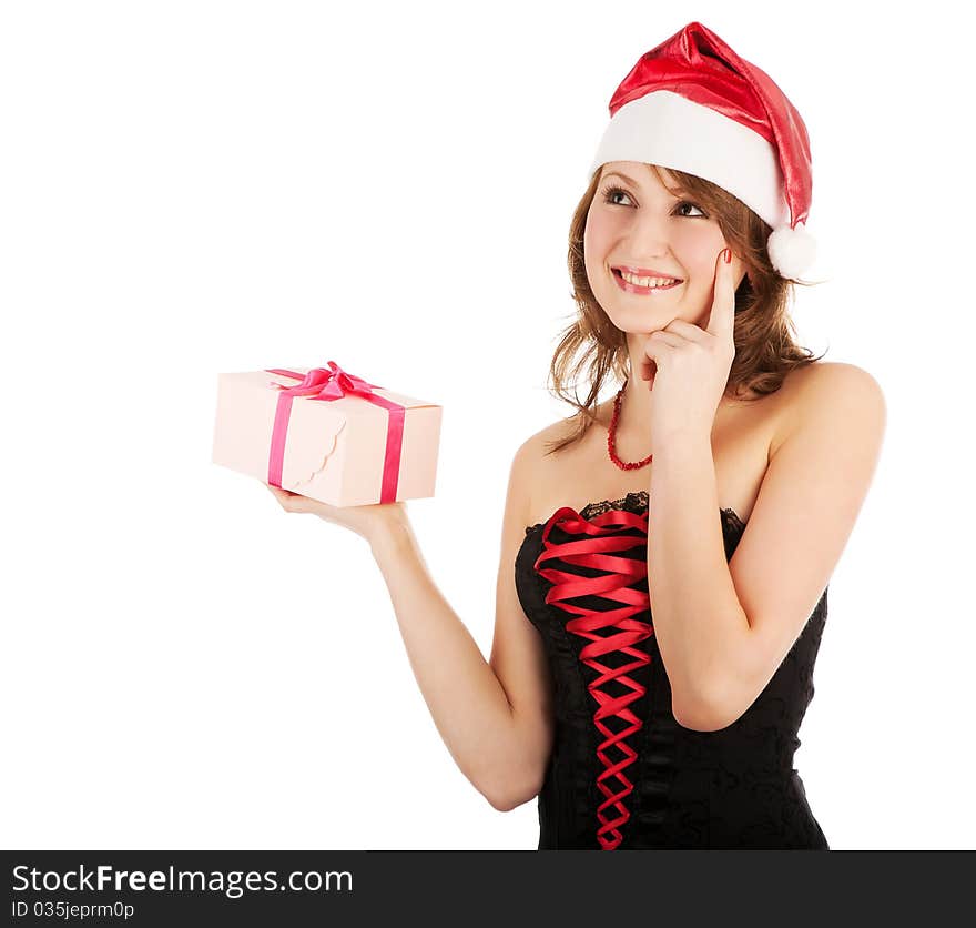 Winter portrait of a beautiful young smiling woman with a gift in her hands