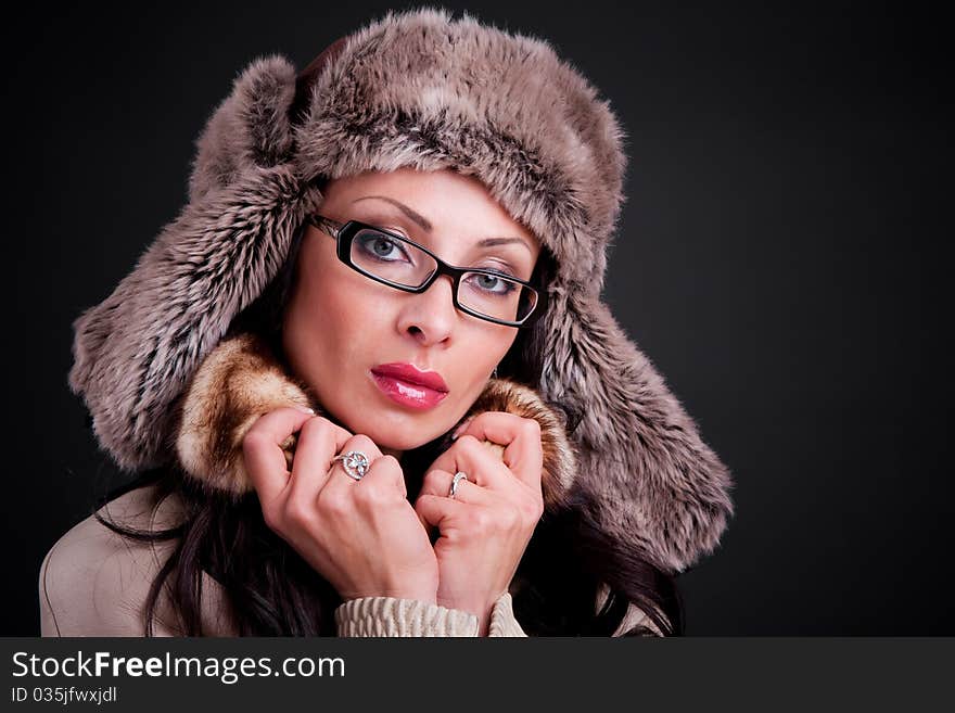 Attractive girl wear in winter fur hat