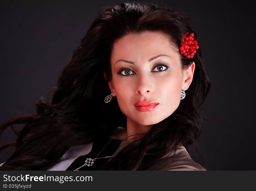 Sexy girl, with a branch of viburnum in her hair