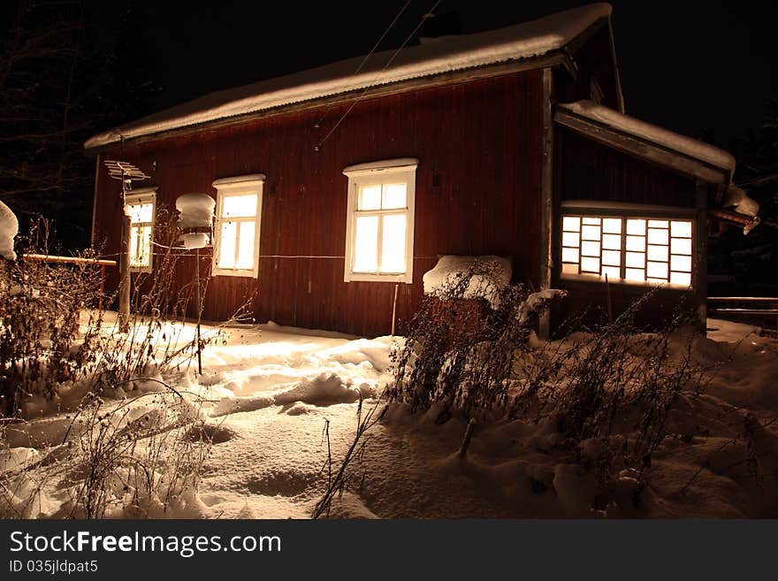 Classic Red wooden Finnish house in winter