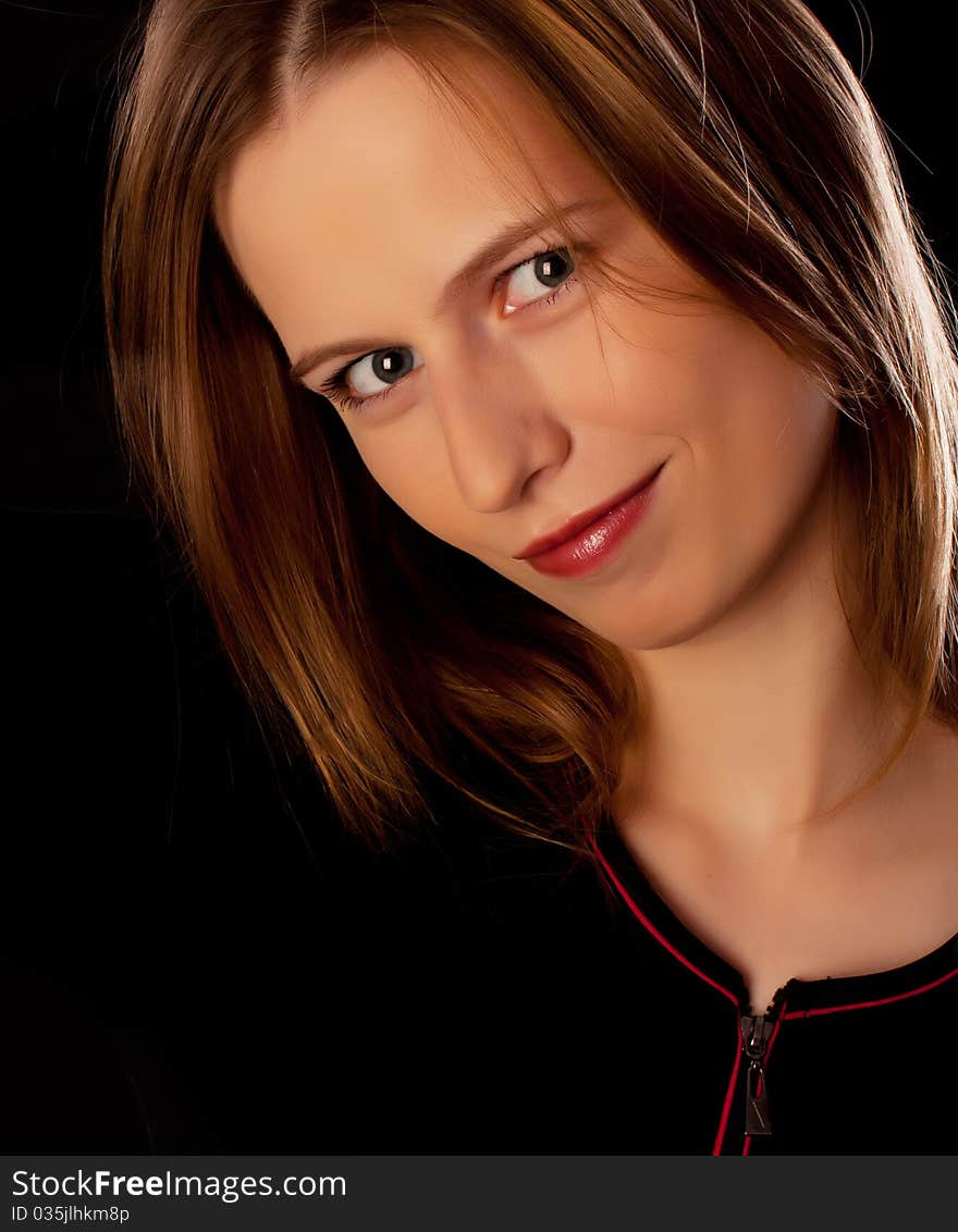 Confident happy woman looking in camera on black background