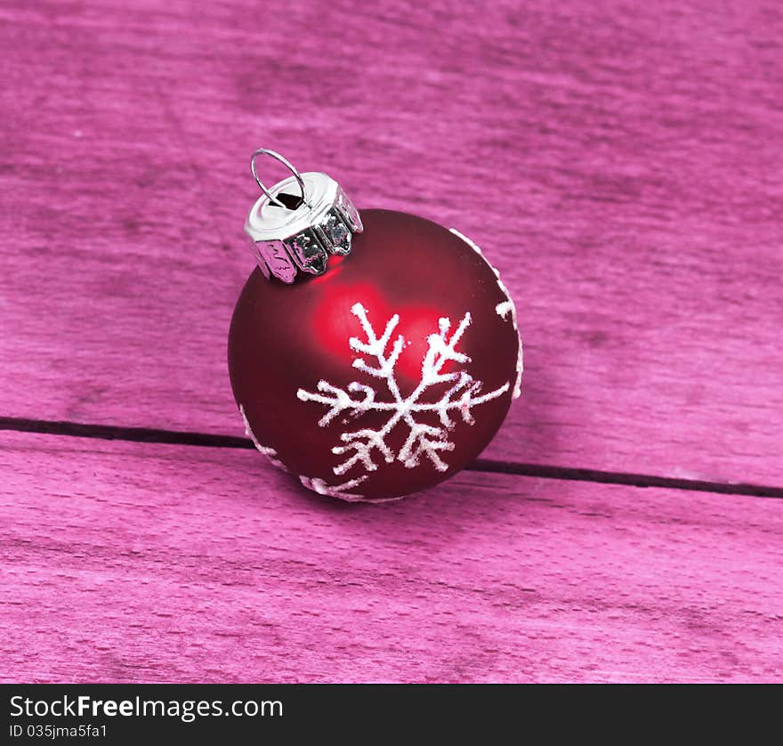 Christmas ornament bauble on wooden background. Rustic style. Christmas ornament bauble on wooden background. Rustic style