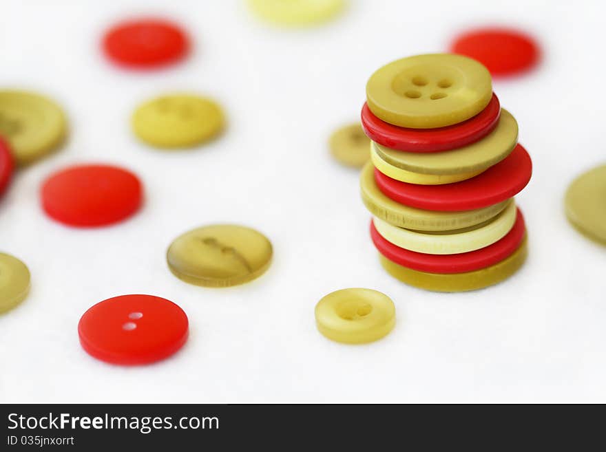 Pyramid from red and green buttons on the white background