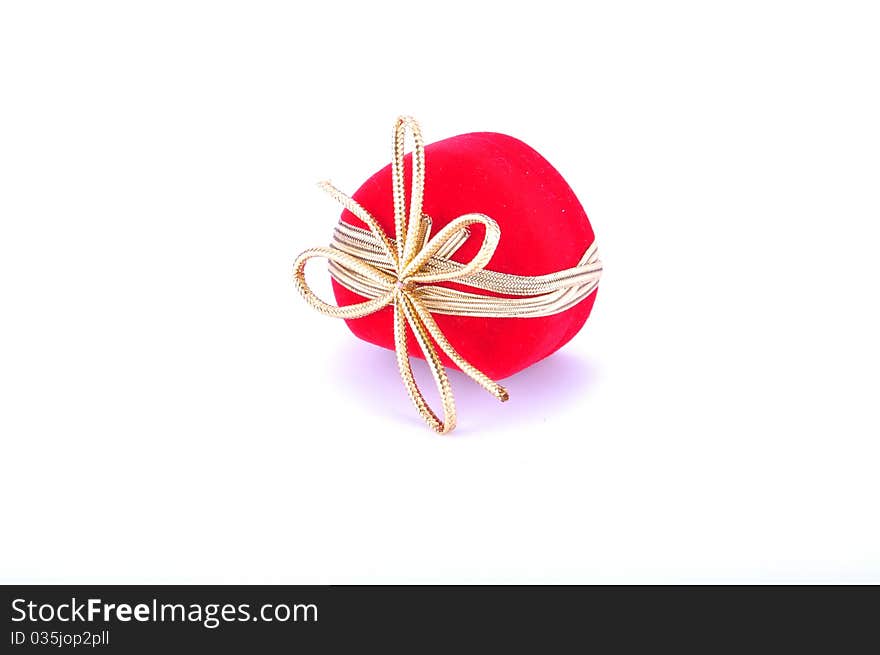 Heart shaped red gift box on white