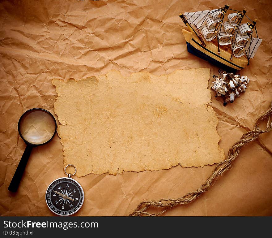 Loupe, rope and model classic boat on grunge background