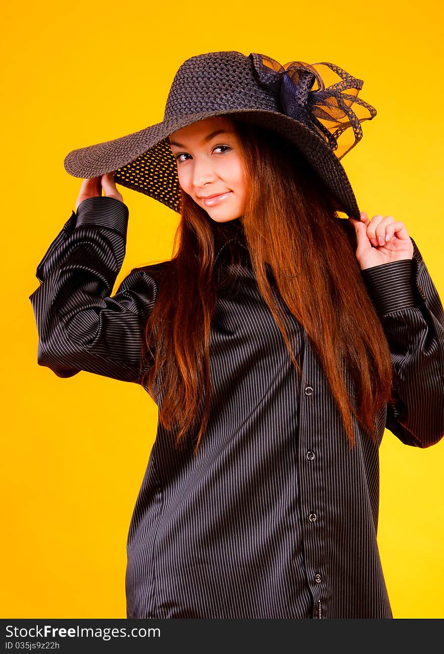 Charming young  woman in a hat