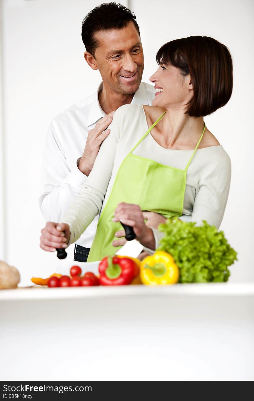 Happy Mature Couple Cooking Together. Happy Mature Couple Cooking Together