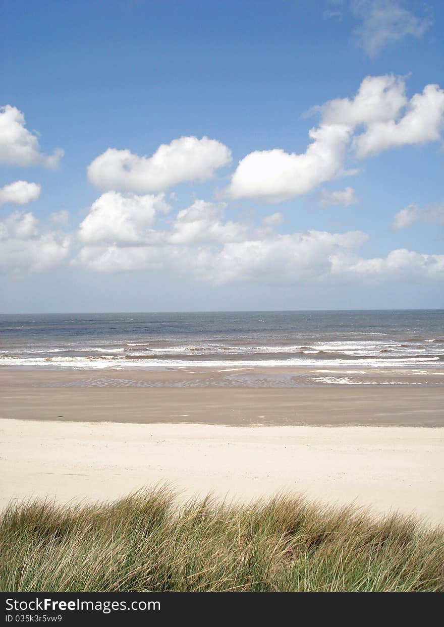 Beach With Clouds And Blue Skie