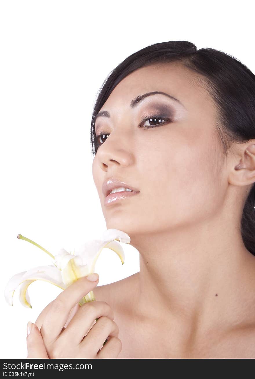 Portrait of a girl, with a lily on a white background. Brunette. Portrait of a girl, with a lily on a white background. Brunette