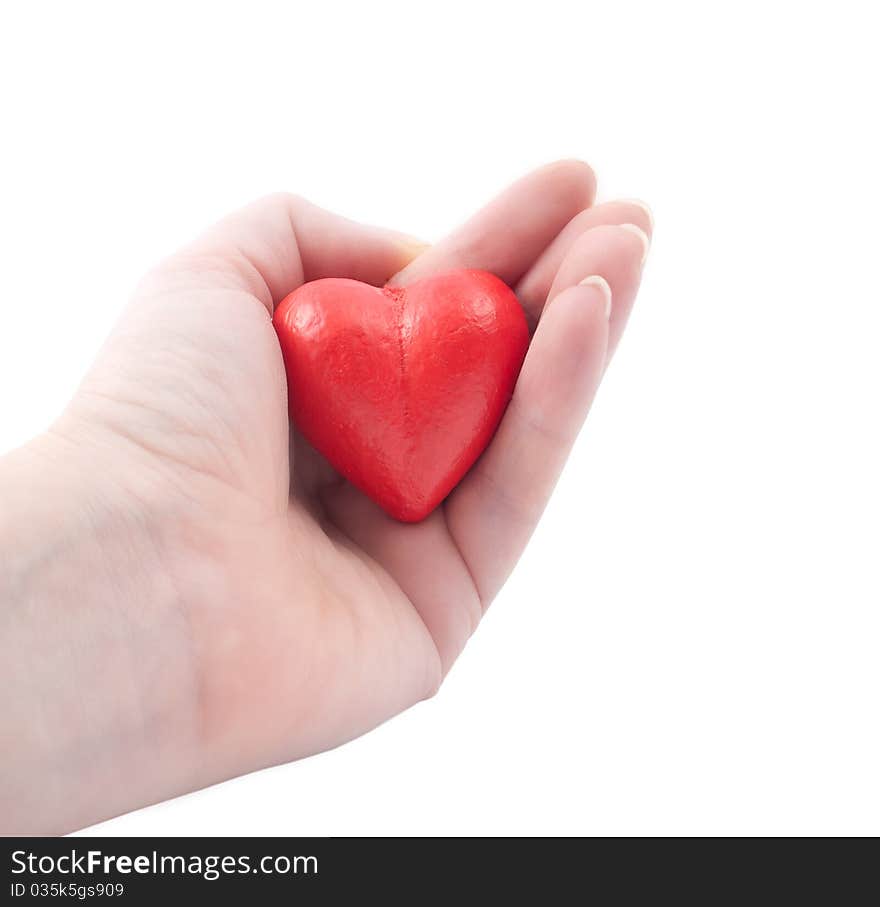 Red heart in my hand on a white background