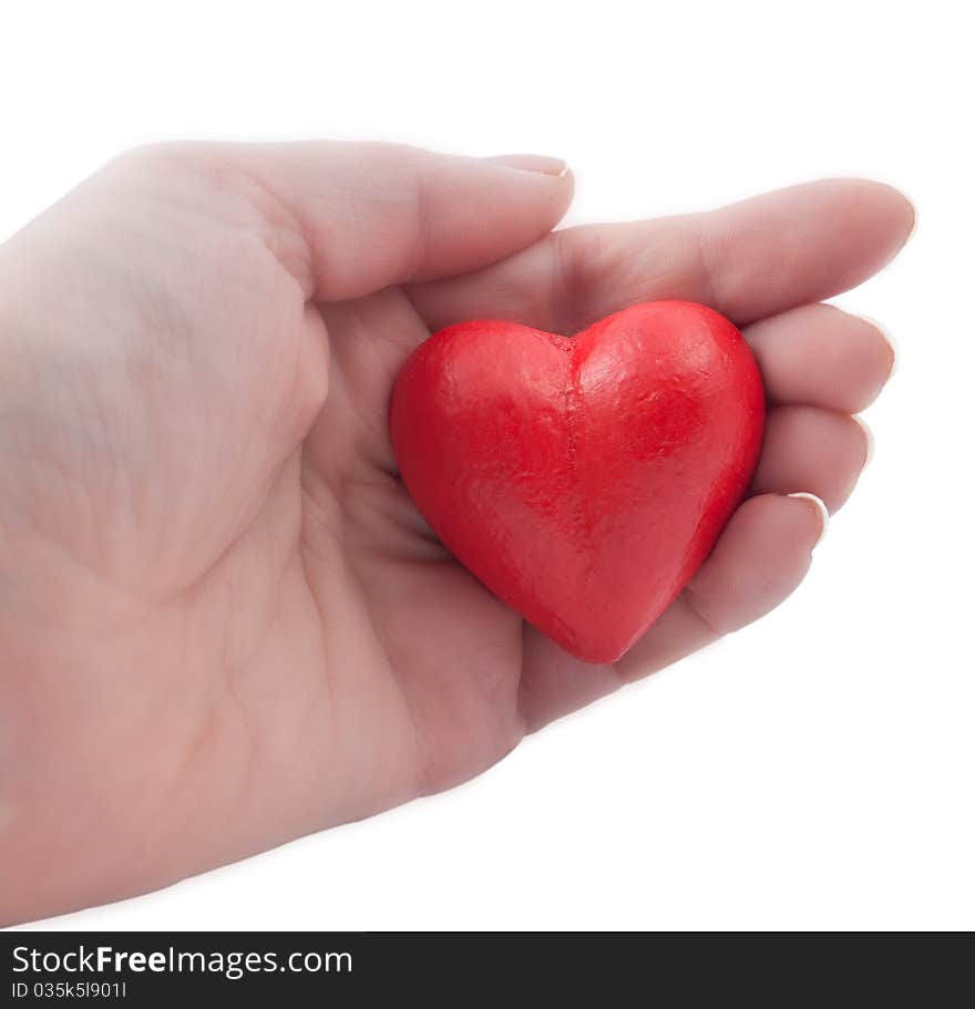 Red heart in my hand on a white background