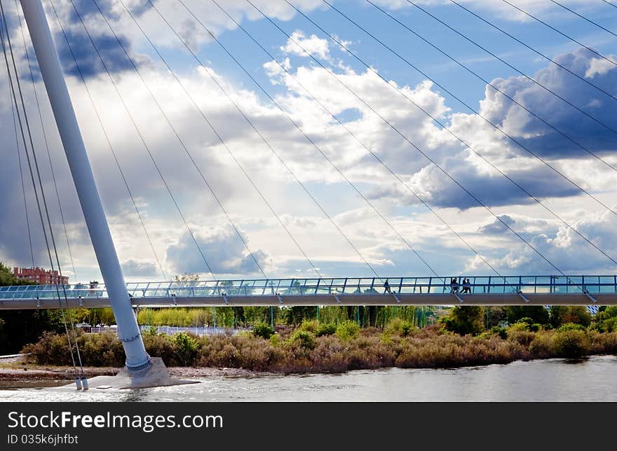 Cityscape with modern bridge and people