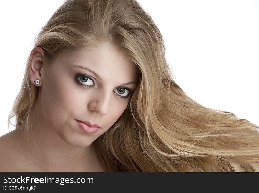 Intense close up of pretty teenage girl with big green eyes and beautiful hair