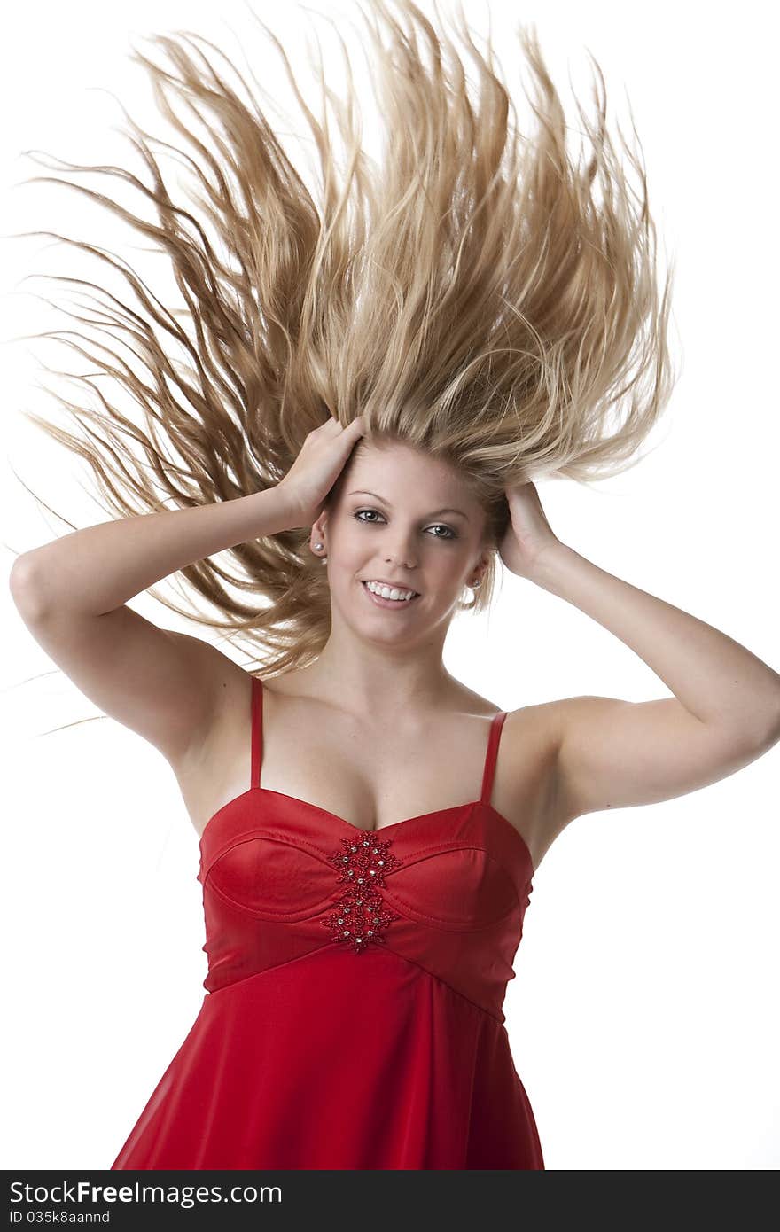 Beautiful blonde teenage girl with flying hair