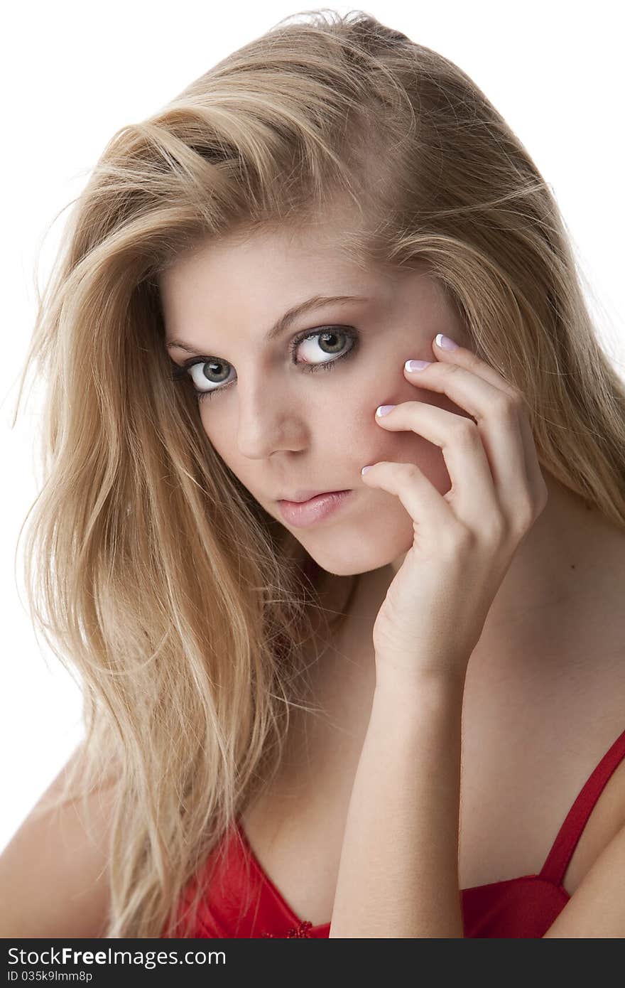 Intense close-up of pretty teenage girl with big eyes and beautiful hair in a red dress. Intense close-up of pretty teenage girl with big eyes and beautiful hair in a red dress