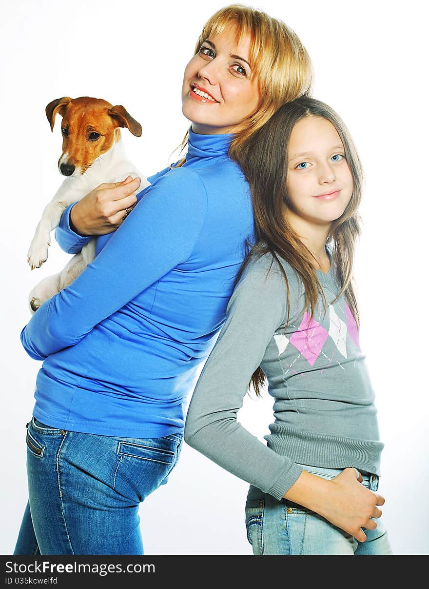 Young mother and her daughter with Jack Russell Terrier. over white background. Young mother and her daughter with Jack Russell Terrier. over white background