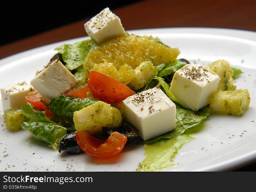 Salad with fresh vegetables, grapefruit and cheese