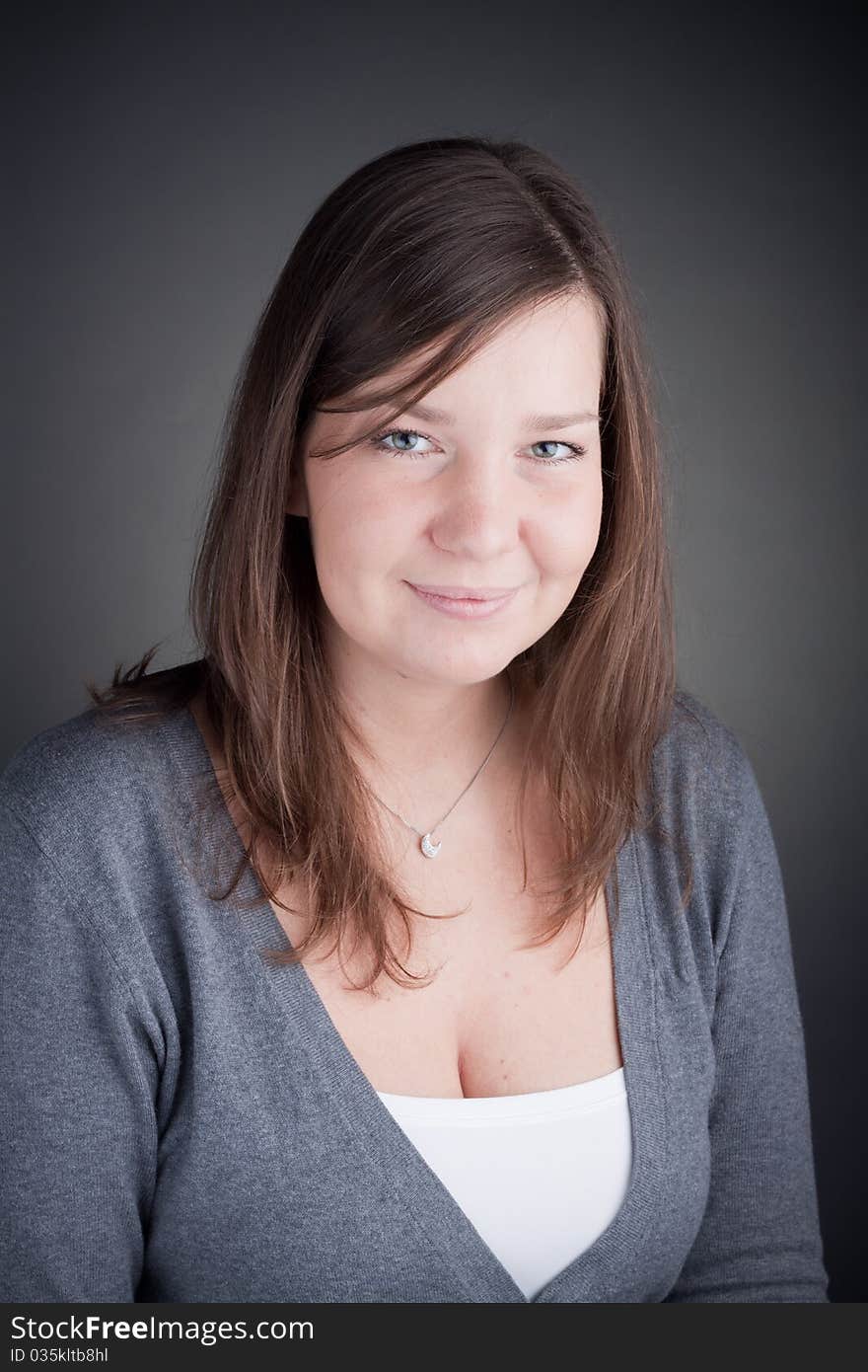 Beautiful smiling woman, with grey background