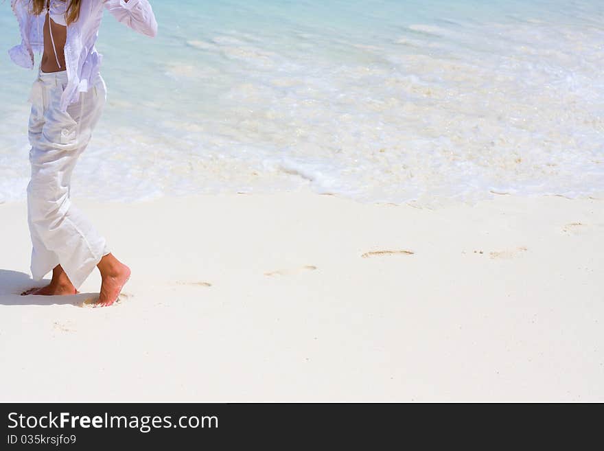 Young woman goes on a coastline