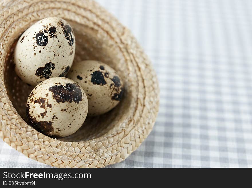 Quail eggs in a decorative wicker hat