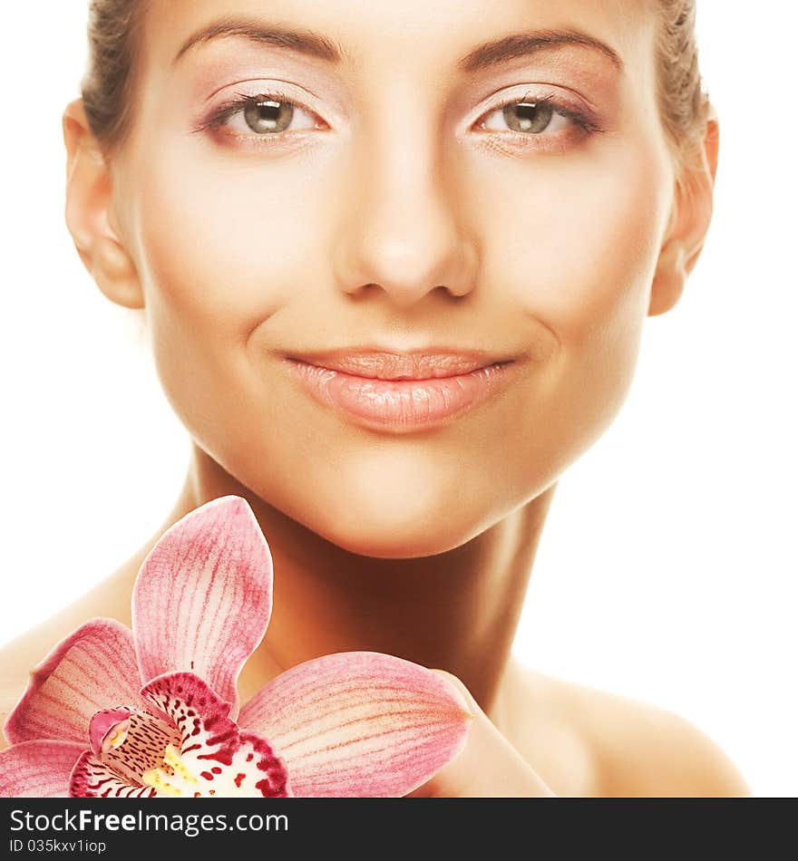 Beautiful girl holding orchid flower in her hands. Beautiful girl holding orchid flower in her hands