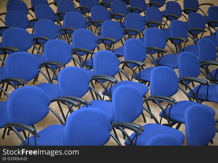 Blue seats on ballroom. Plastic chairs