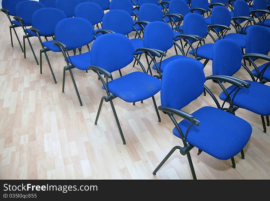 Blue seats on ballroom. Plastic chairs