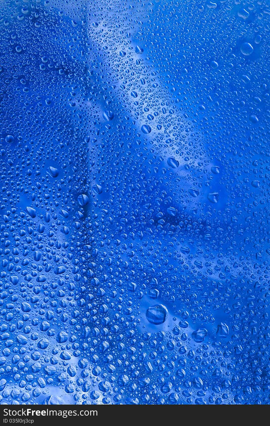 Pattern refracted in drops of water ideal as a background. Pattern refracted in drops of water ideal as a background.