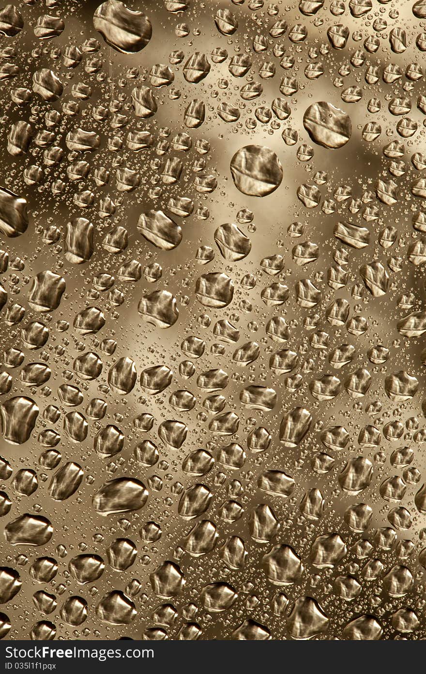 Pattern refracted in drops of water ideal as a background. Pattern refracted in drops of water ideal as a background.