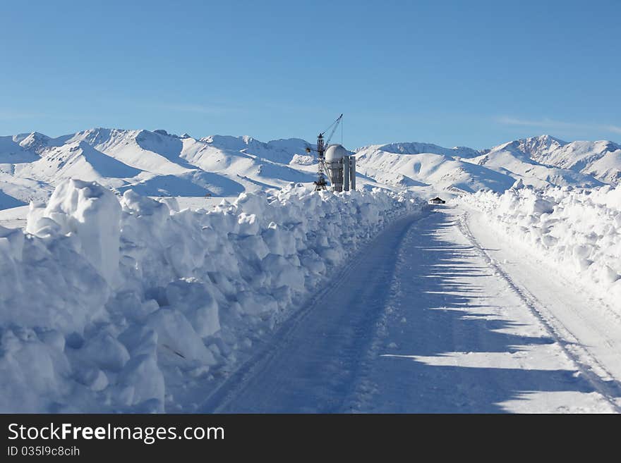 Winter road to mountains to station. Winter road to mountains to station