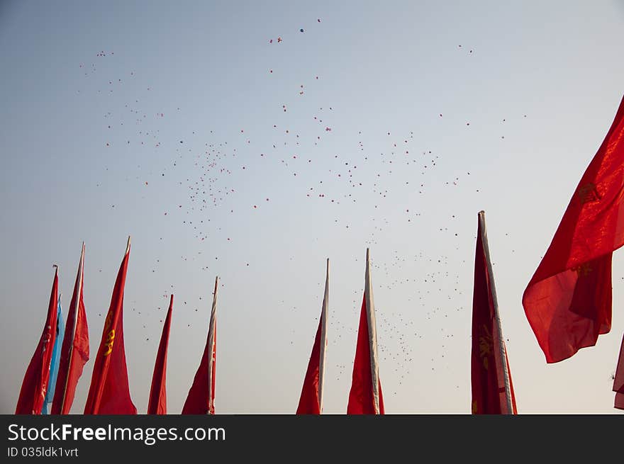 Balloons and flags, blue sky