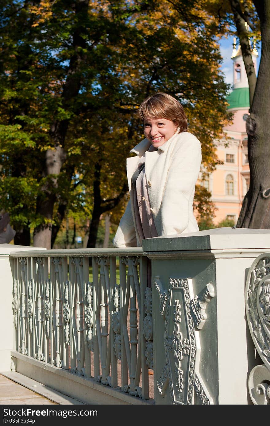 Charming young woman in an autumn park