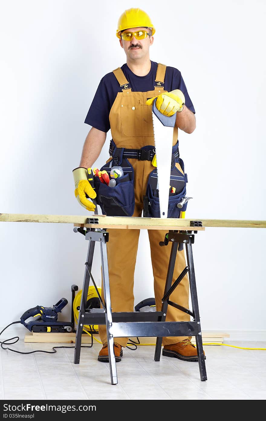 Mature contractor working. Over white background