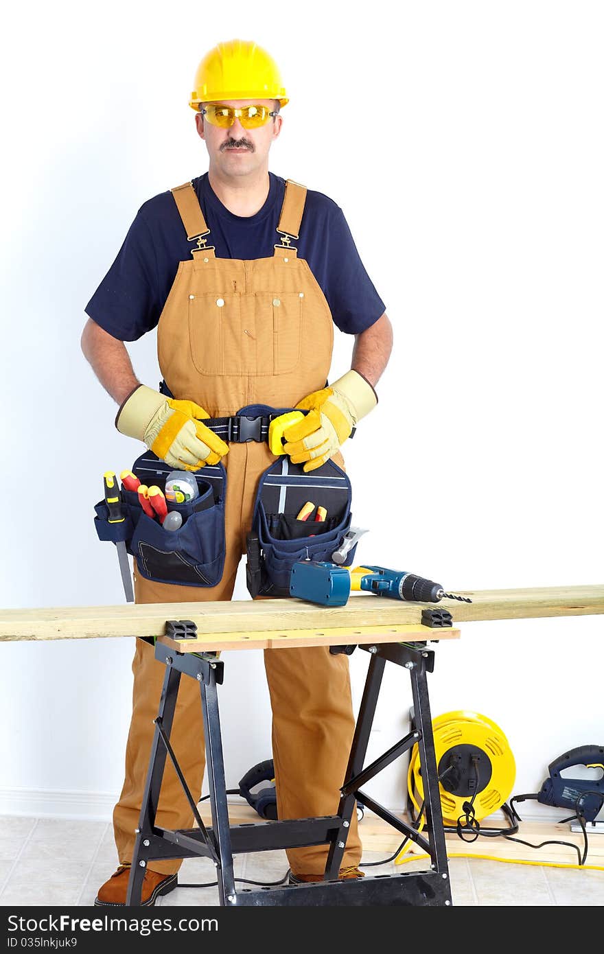 Mature contractor working. Over white background