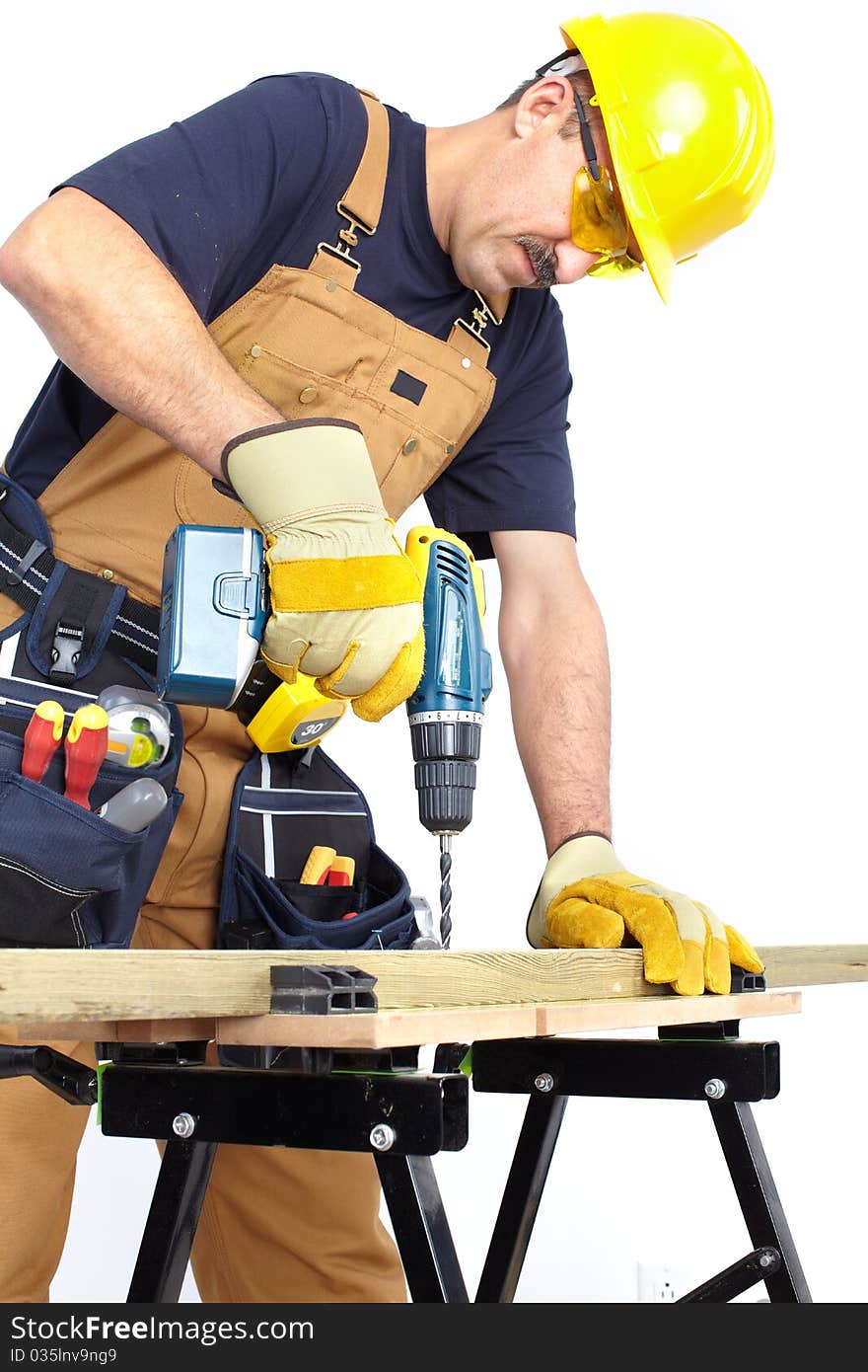 Mature contractor with a drill. Over white background. Mature contractor with a drill. Over white background