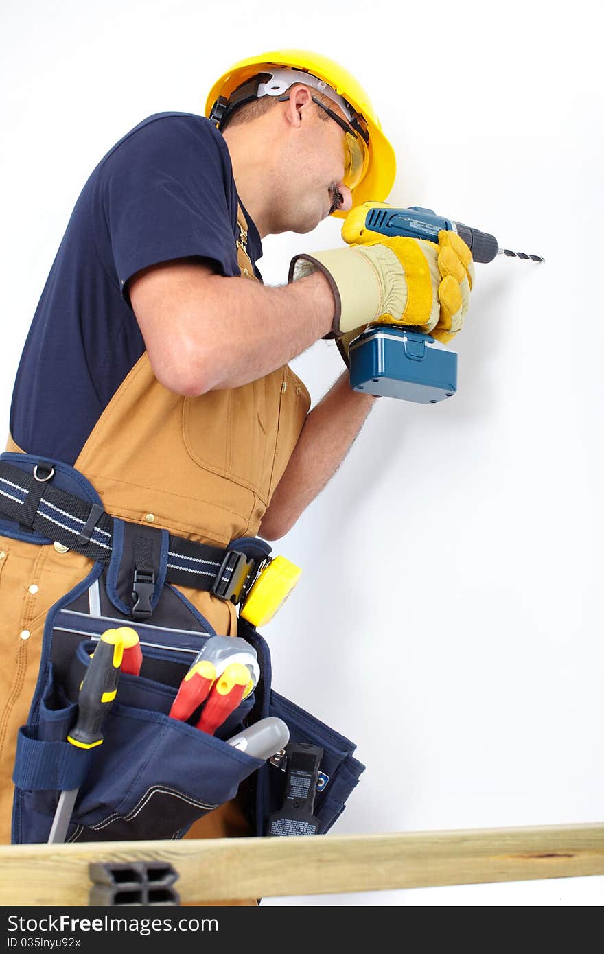 Mature contractor with a drill. Over white background. Mature contractor with a drill. Over white background