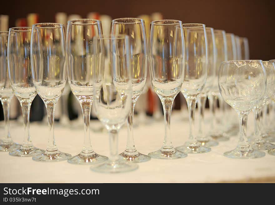 Various types of empty glasses standing in a row