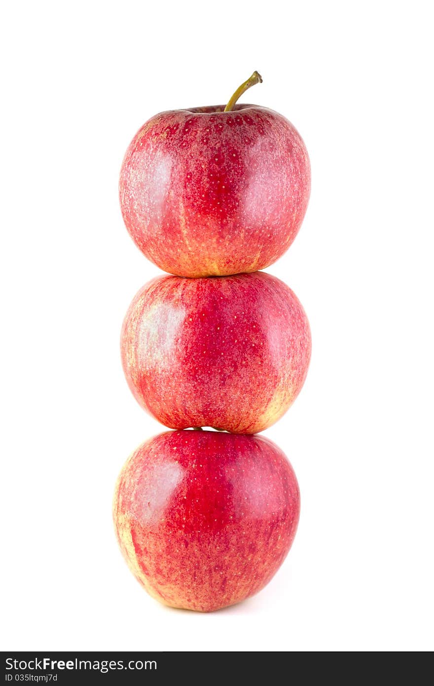 Stack of three red ripe apples