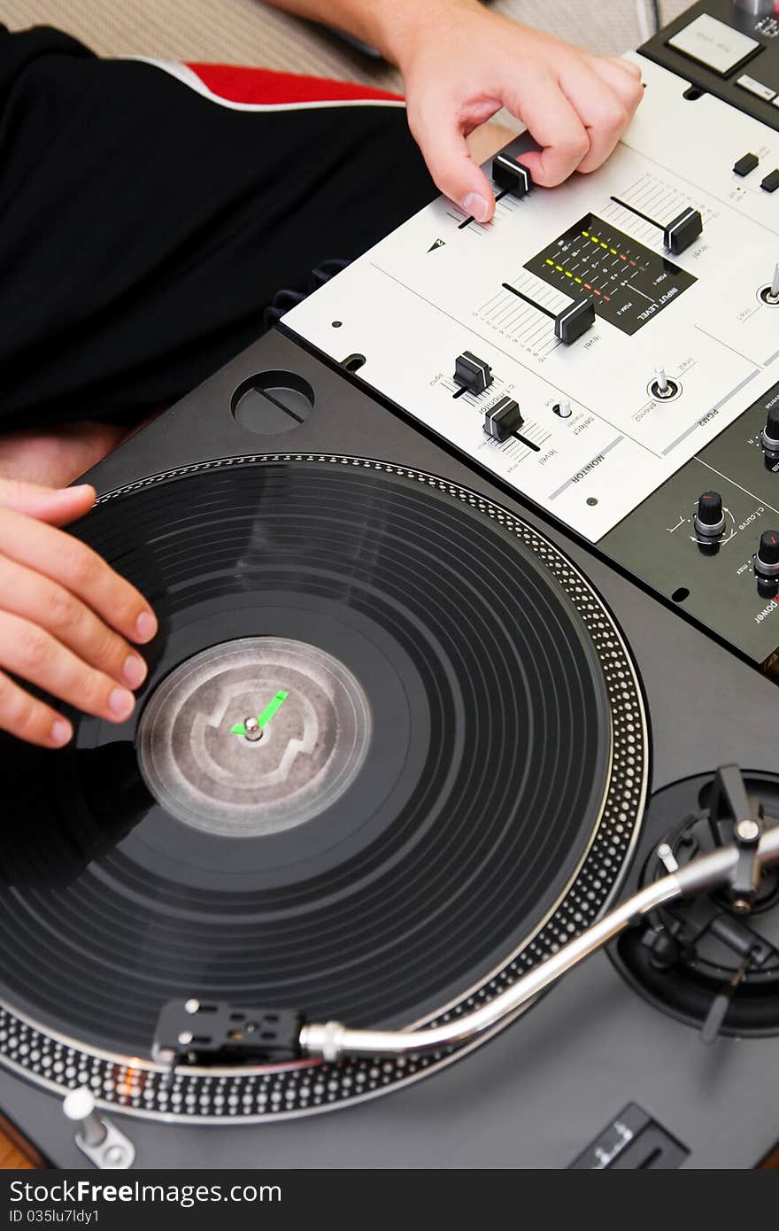 Hip-hop DJ Scratching The Vinyl Record