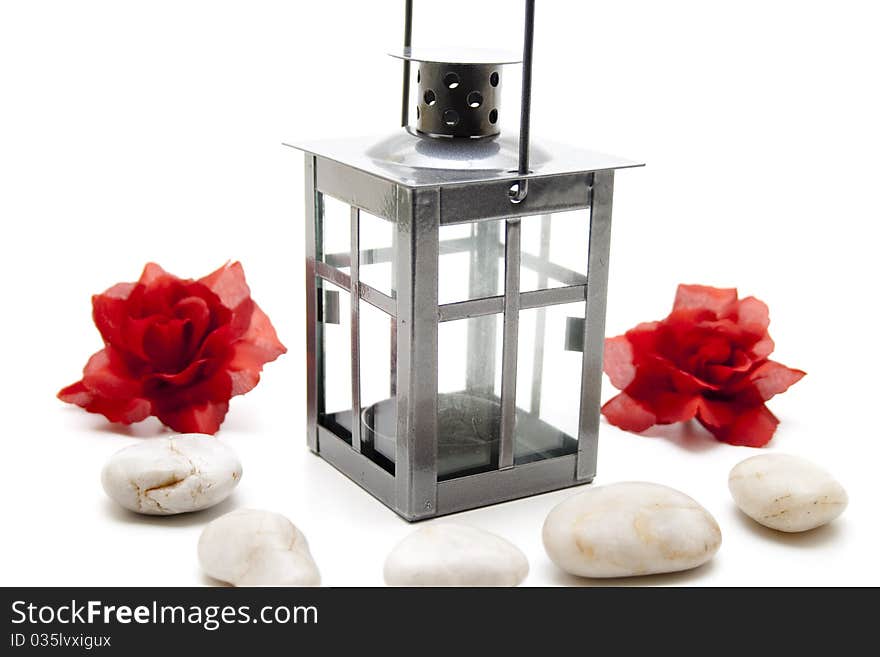 Wind light with red roses and stone