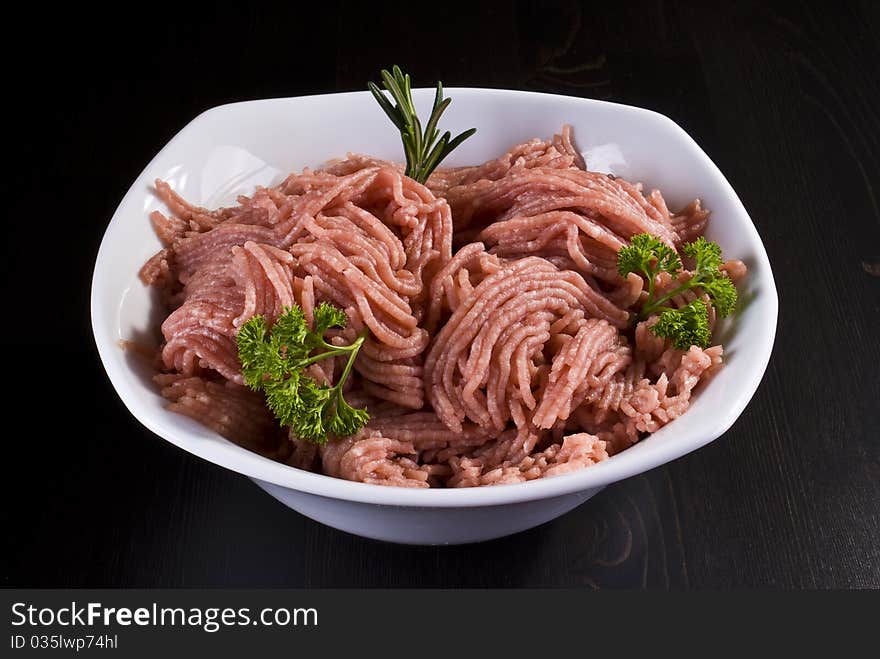 Bowl of raw minced pork with herbs. Bowl of raw minced pork with herbs