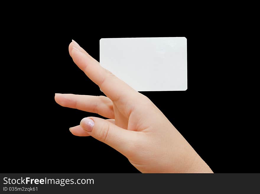 Paper card in woman hand on black background