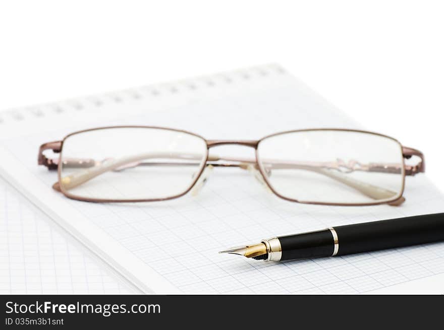 Fountain Pen and blank spiral bound notepad still life