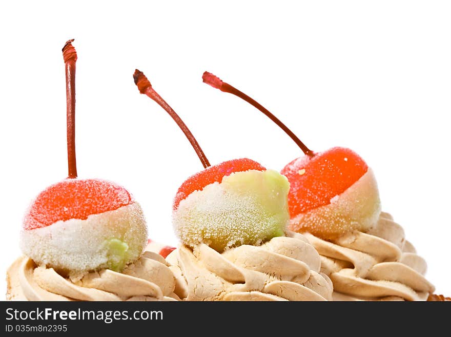 Red cherries on top of cake. Red cherries on top of cake