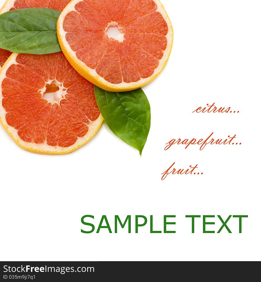 Fresh juicy grapefruits and green leafs