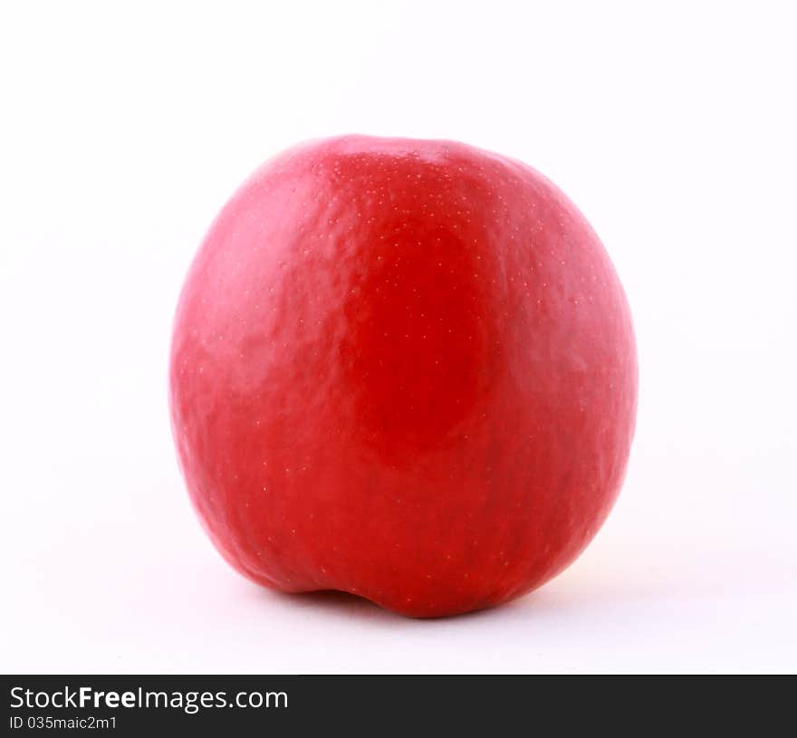 Close-up of juicy ripe red apple isolated on white