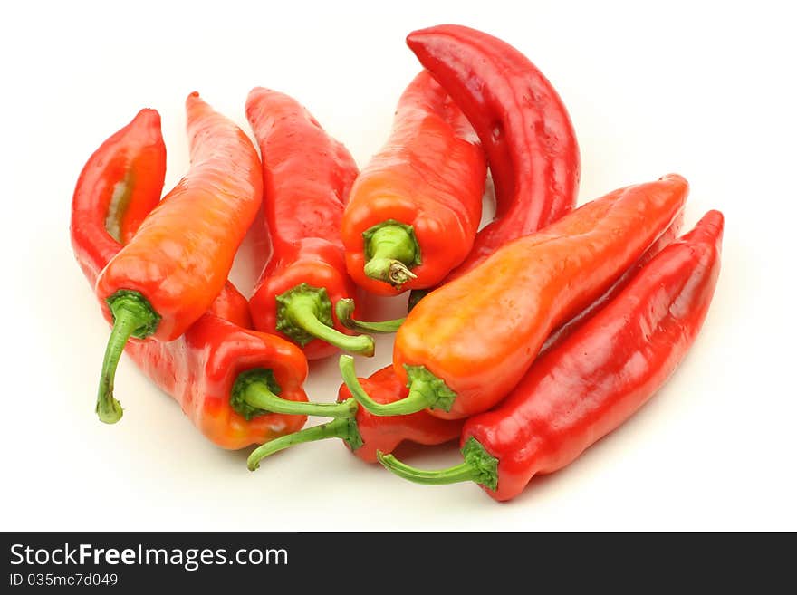 Red Peppers on white background.